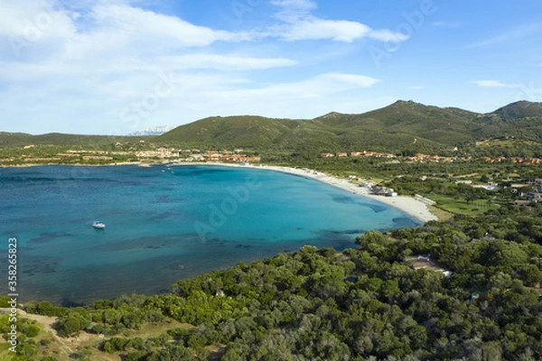 Fototapeta View from above, stunning aerial view of a white sand beach with beach umbrellas and a beautiful turquoise sea. Marinella Beach, Porto Rotondo,Sardinia, Italy.