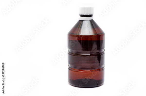 Fototapeta One bottle of cinnamon color plastic bubble on a white background with a white cap. Bubble with under antiseptic, hawthorn. Brown empty bottle with white cap in close-up