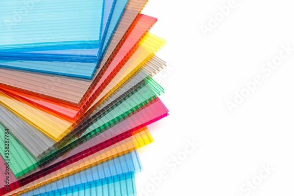 Obraz Polycarbonate plastic sheets panels images. PC hollow sheet for translucent roofing on white background.Many colors