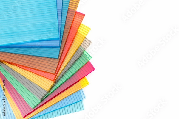 Fototapeta Polycarbonate plastic sheets panels images. PC hollow sheet for translucent roofing on white background.Many colors