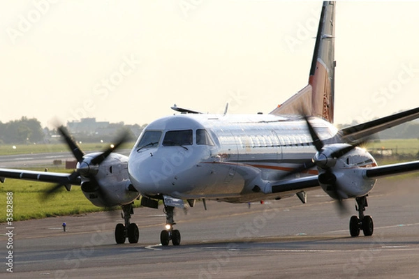 Obraz Turboprop airplane on taxiway