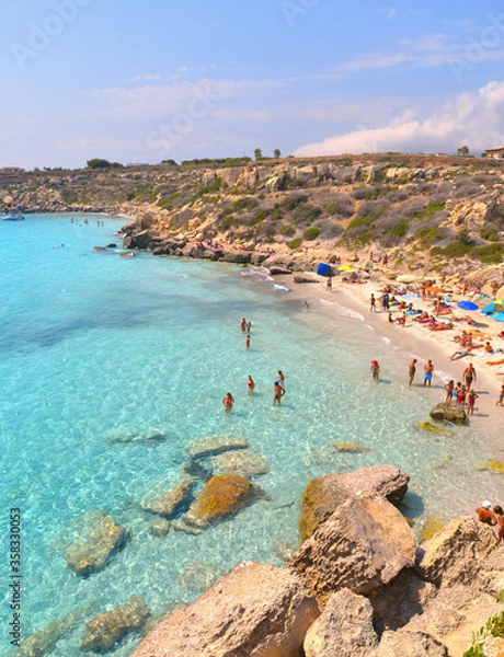 Fototapeta  paradise clear turquoise blue water with rocks in Favignana island, Cala Azzura Beach, Sicily South Italy.