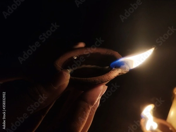 Obraz Lamp in a hand
