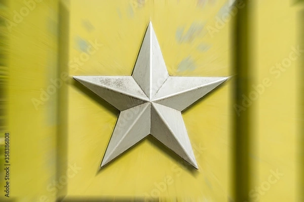 Fototapeta silver metal five pointed Soviet star on a blurred background of light greenish yellow color