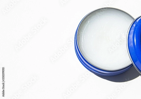 Obraz Petroleum jelly in a blue jar for skin moisture and healing.