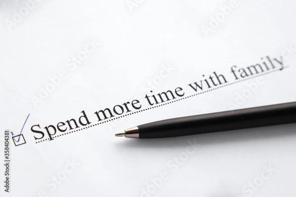 Fototapeta a piece of paper with the inscription spend more time with family from to do list with a tick 
