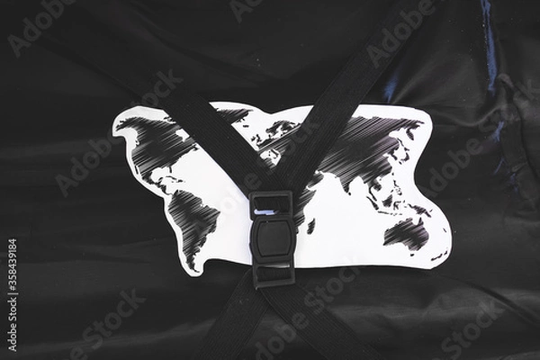 Fototapeta travel industry concept, open carry-on luggage with world map inside of it