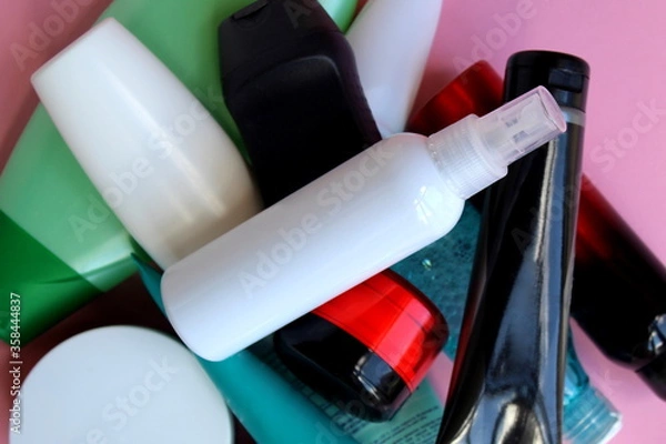 Obraz A bunch of plastic bottles with cosmetic creams and lotions