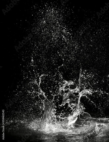 Obraz water splash on black background