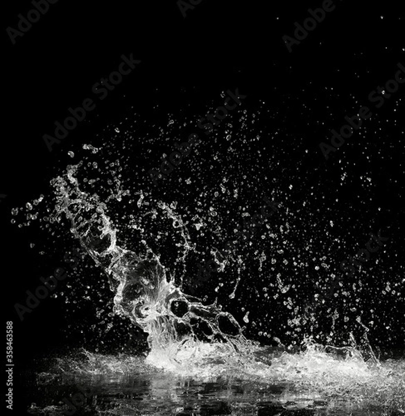 Obraz water splash on black background