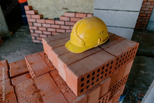 Obraz construction helmet and bricks