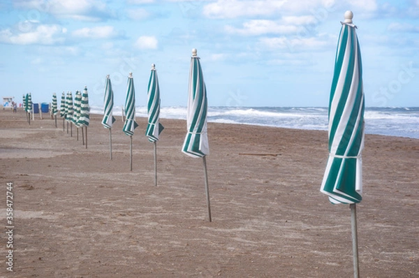 Obraz Closed umbrellas on the beach of pinamar, Buenos Aires, Argentina