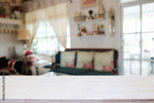 Fototapeta Empty wooden table space platform and blurred restaurant or coffee shop background for product display montage.