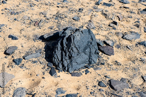 Fototapeta It's Black desert lanscape and basalt formarions