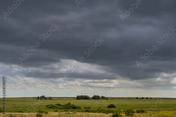 Fototapeta storm clouds over the field