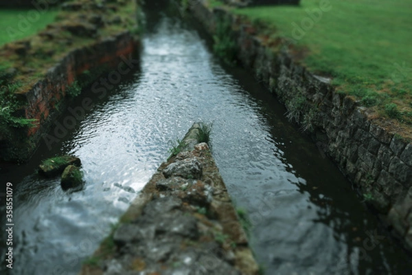 Obraz Water Flowing through Ruins