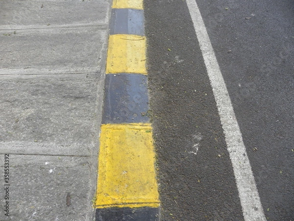 Fototapeta Asphalt road textured background with yellow and white line