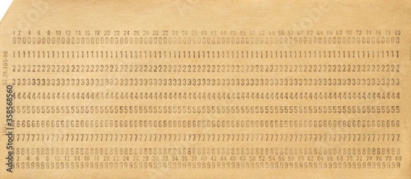 Fototapeta Paper punch card for storing information in the first electronic computers. One punch card. Data storage. Close up. Top view.