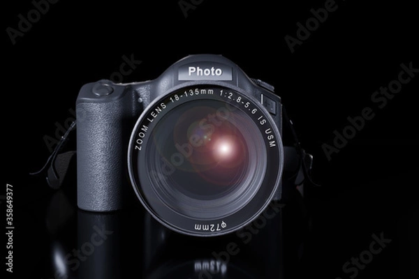 Obraz Front view of professional digital single lens reflex camera with a zoom lens and a strap on a black background with copy space. Realistic 3d render. Place for advertising text. Reflection at bottom