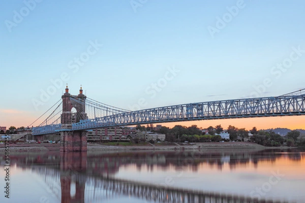 Fototapeta John A. Roebling Bridge during sunrise in Cincinnati.