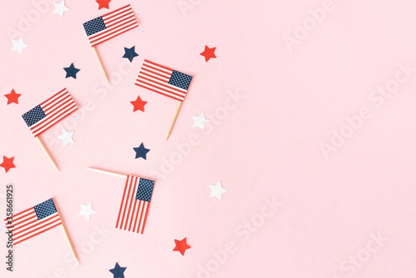 Obraz Many american flags and stars on pink background, flat lay. Celebration in America. 4th of july, happy usa independence day. Copy space for text.