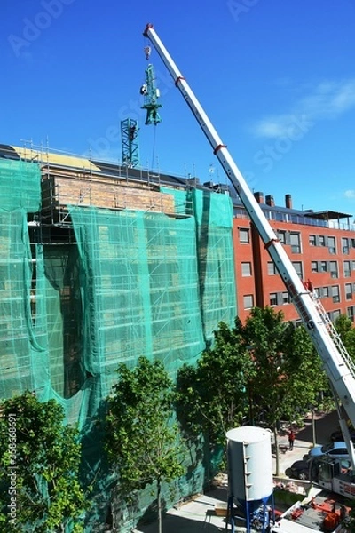 Obraz building under construction with crane