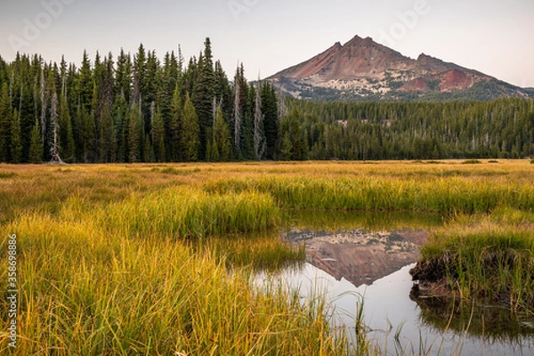 Fototapeta High mountain field with mountain reflection