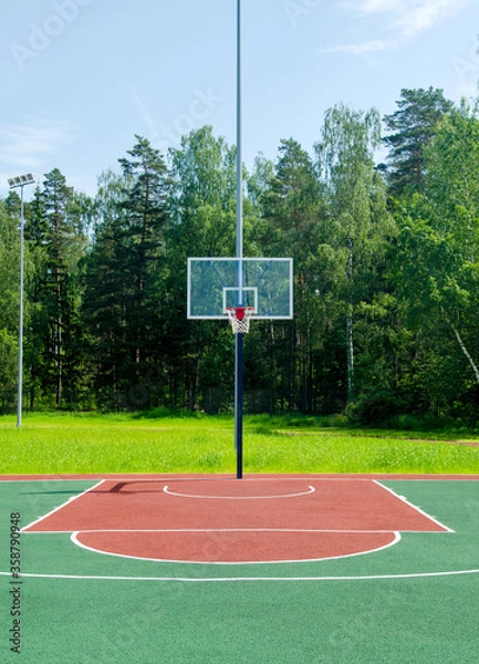 Obraz Empty sreet basketball court in the park on the sunny summer day.