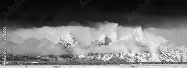 Obraz Tetons in the Clouds - The Grand Tetons slowly appear as the cloud cover melts away. Grand Tetons National Park, Wyoming.