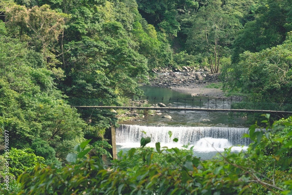 Obraz Small waterfall and bridge in the forest