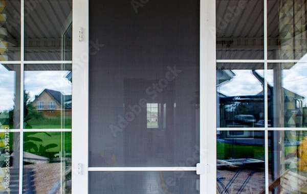 Obraz plastic door with mosquito net