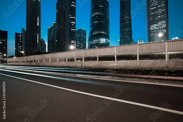 Obraz Empty road surface with city landmark buildings of night