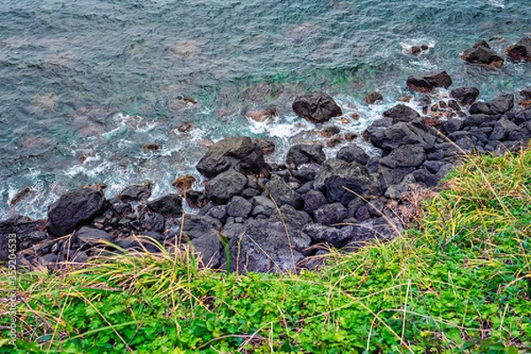 Fototapeta Aerial view of the rocky beach at the Seopjikoji in Jeju Island. Soft focus effect due to large aperture setting