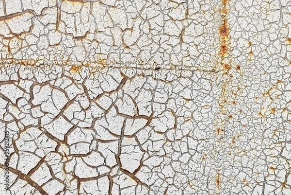 Obraz White cracked paint is applied to a rusty surface