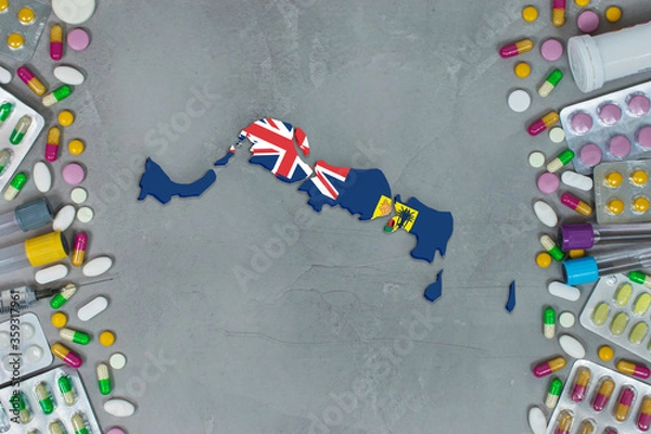 Obraz The Turks and Caicos IslandsState began research for treatment and medicine to combat the pandemic outbreak disease coronavirus. Medicine, pills, needles, syringes and  map and flag on background.
