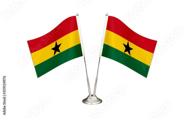 Obraz Ghana table flag isolated on white ground. Two flag poles with flags and Ghana flag on the table.