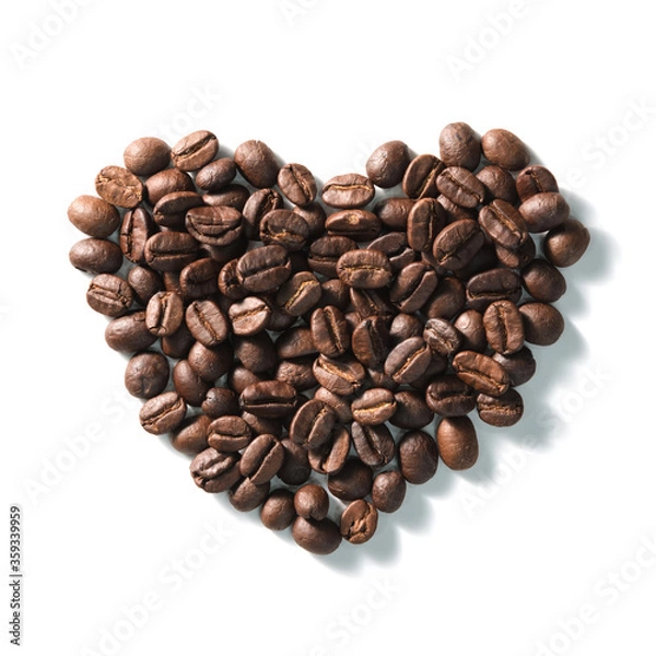 Fototapeta Love sign with coffee beans arranged Heart shape over white background.