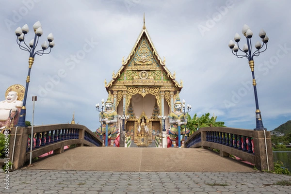 Fototapeta The Thai temple in Wat Plai Laem in Samui Island Thailand, in the middle of the water, contains giant statues and elephants.