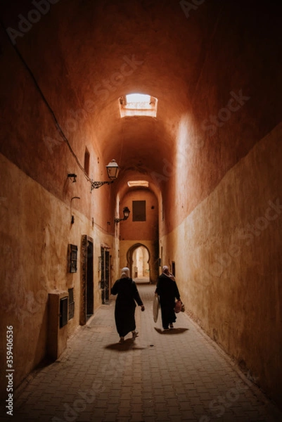 Obraz Narrow streets of the medina in Fez city.These streets are very authentic and attractive for tourists.Local people and tourists mostly shops in these streets.