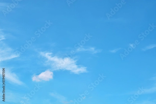 Obraz Bright blue sky with white clouds.