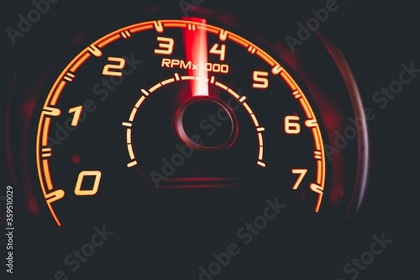 Fototapeta Driver's cockpit ; speedometer on dashboard - colorful light in black, copy space for your abstract design	