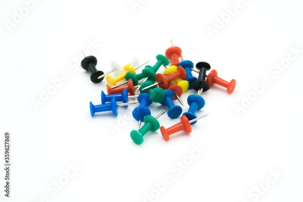 Obraz colored pushpins on a white background