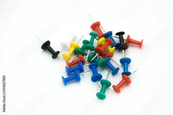 Obraz colored pushpins on a white background