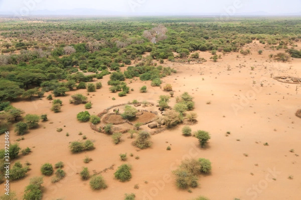 Fototapeta Traditional Masai dwelling in the Great Rift Valley, Kenya. The Great Rift Valley is part of an intra-continental ridge system that runs through Kenya from north to south.