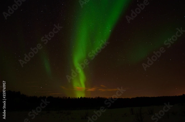 Obraz strong aurora borealis, northern light over frozen arctic circle landscape in winter night
