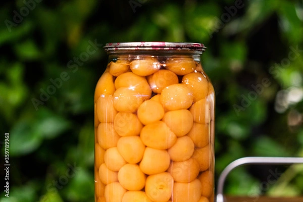 Fototapeta Jar of cherry plum compote close view