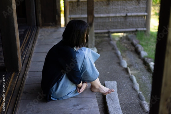 Fototapeta 座る女性