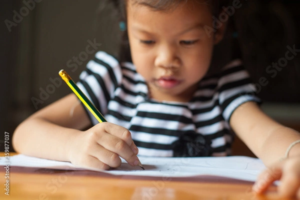 Obraz Children who are serious about writing books and doing homework.