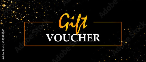 Fototapeta Gift voucher on a black background with a gold decoration. Gold spray, golden frame. 