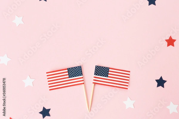 Obraz Two usa flag toothpick and star around on pink background, flat lay. 4th of july in America, celebration independence day in usa. Copy space for text in center.